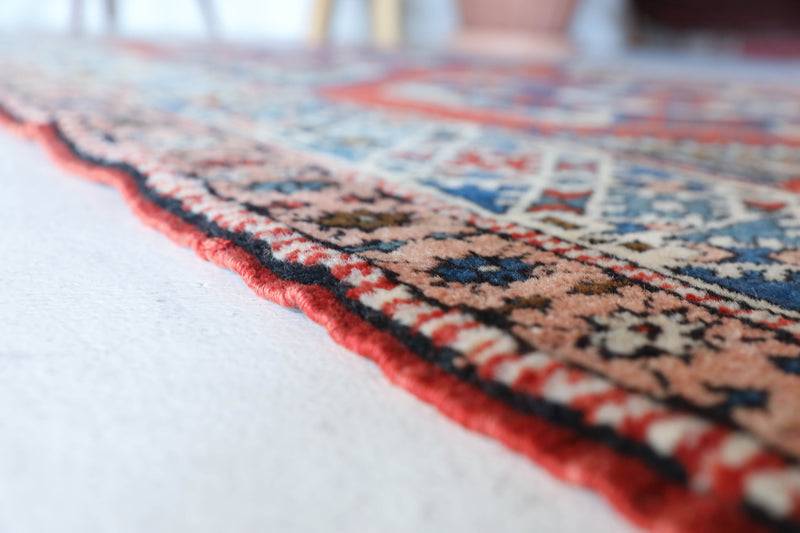 Vintage Turkish rug in living room setting, old rug, antique rug, pastel colors, faded colors, Turkish rug, vintage rug, soft rug, Portland, Oregon, rug store, rug shop, local shop