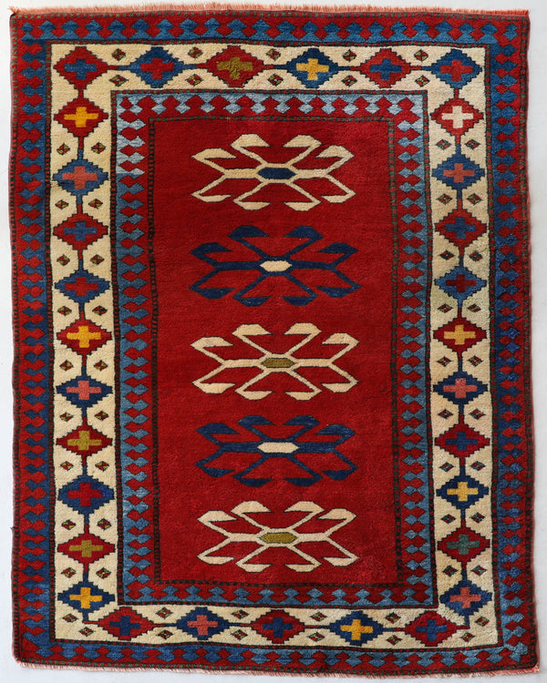 Vintage Turkish rug in a living room setting, pile rug, Turkish rug, vintage rug, portland, rug shop, bright colors, wild shaman, soft rug, bold color, Portland, Oregon, rug store, rug shop, local shop