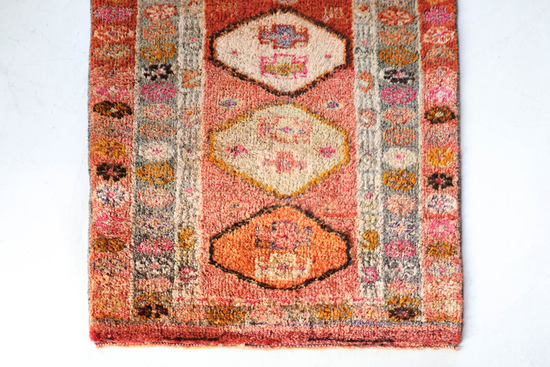 Vintage Turkish runner rug in a living room setting, pile rug, Turkish rug, vintage rug, portland, rug shop, bright colors, wild shaman, soft rug, bold color, Portland, Oregon, rug store, rug shop, local shop