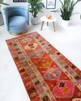 Vintage Turkish runner rug in a living room setting, pile rug, Turkish rug, vintage rug, portland, rug shop, bright colors, wild shaman, soft rug, bold color, Portland, Oregon, rug store, rug shop, local shop