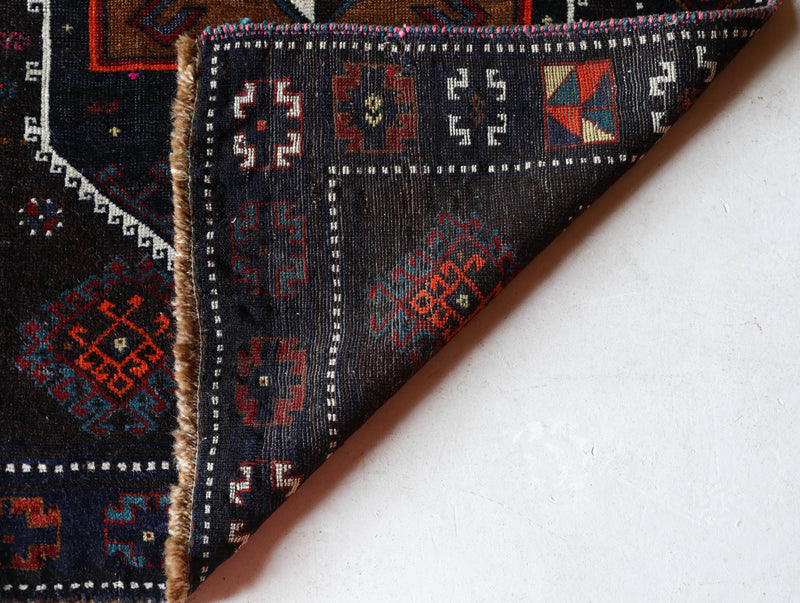 Vintage Turkish runner rug in a living room setting, pile rug, Turkish rug, vintage rug, portland, rug shop, bright colors, wild shaman, soft rug, bold color, Portland, Oregon, rug store, rug shop, local shop