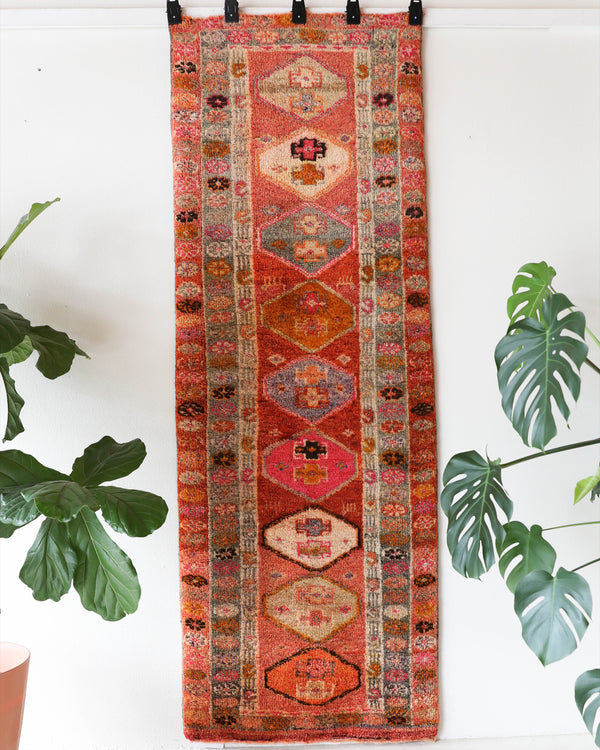 Vintage Turkish runner rug in a living room setting, pile rug, Turkish rug, vintage rug, portland, rug shop, bright colors, wild shaman, soft rug, bold color, Portland, Oregon, rug store, rug shop, local shop