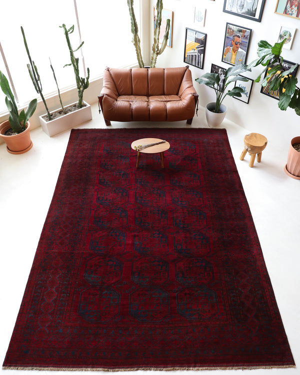 Antique Turkmen rug in a living room setting, pile rug, Turkish rug, vintage rug, portland, rug shop, bright colors, wild shaman, soft rug, bold color, Portland, Oregon, rug store, rug shop, local shop, antique rug