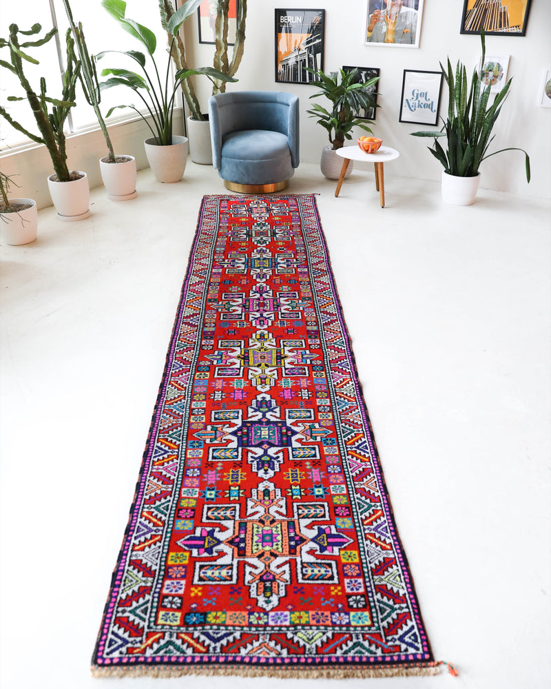 Vintage Turkish runner rug in a living room setting, pile rug, Turkish rug, vintage rug, portland, rug shop, bright colors, wild shaman, soft rug, bold color, Portland, Oregon, rug store, rug shop, local shop,