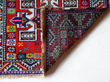 Vintage Turkish runner rug in a living room setting, pile rug, Turkish rug, vintage rug, portland, rug shop, bright colors, wild shaman, soft rug, bold color, Portland, Oregon, rug store, rug shop, local shop,