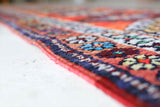 Vintage Turkish runner rug in a living room setting, pile rug, Turkish rug, vintage rug, portland, rug shop, bright colors, wild shaman, soft rug, bold color, Portland, Oregon, rug store, rug shop, local shop