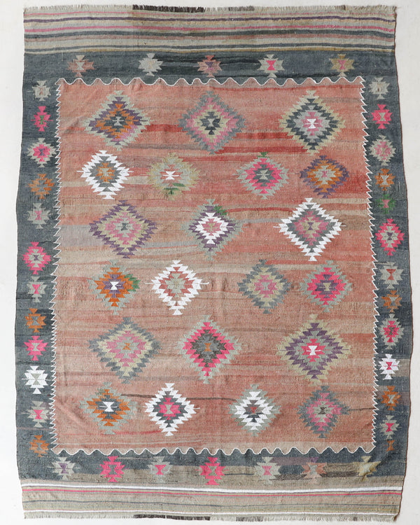 Vintage kilim rug in room decor setting, old rug, antique rug, pastel colors, faded colors, Turkish rug, vintage rug, soft rug, Portland, Oregon, rug store, rug shop, local shop, bold colors, bright colors, faded colors