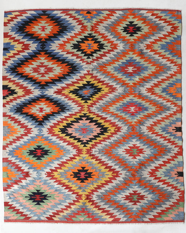 Vintage kilim rug in room decor setting, old rug, antique rug, pastel colors, faded colors, Turkish rug, vintage rug, soft rug, Portland, Oregon, rug store, rug shop, local shop, bold colors, bright colors, faded colors