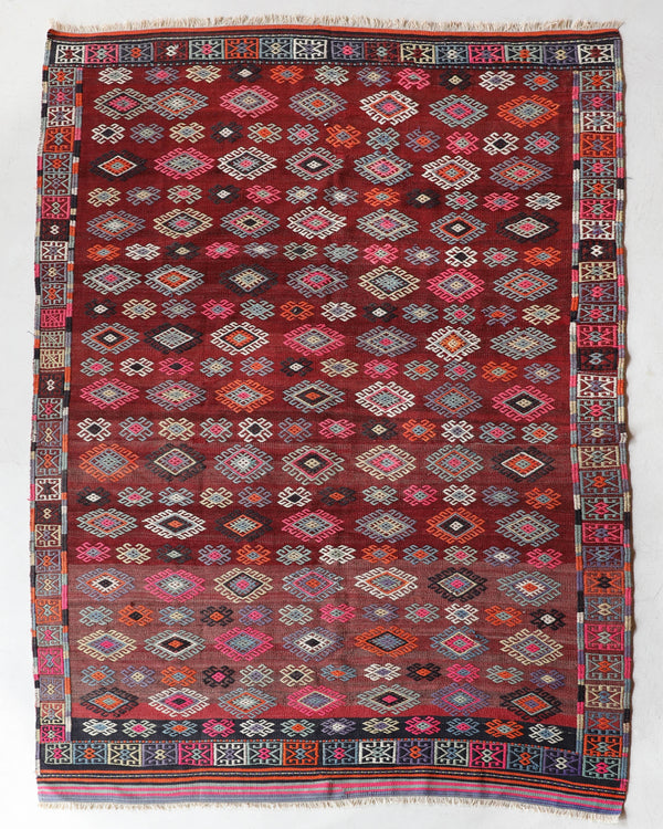 Vintage kilim rug in room decor setting, old rug, antique rug, pastel colors, faded colors, Turkish rug, vintage rug, soft rug, Portland, Oregon, rug store, rug shop, local shop, bold colors, bright colors, faded colors