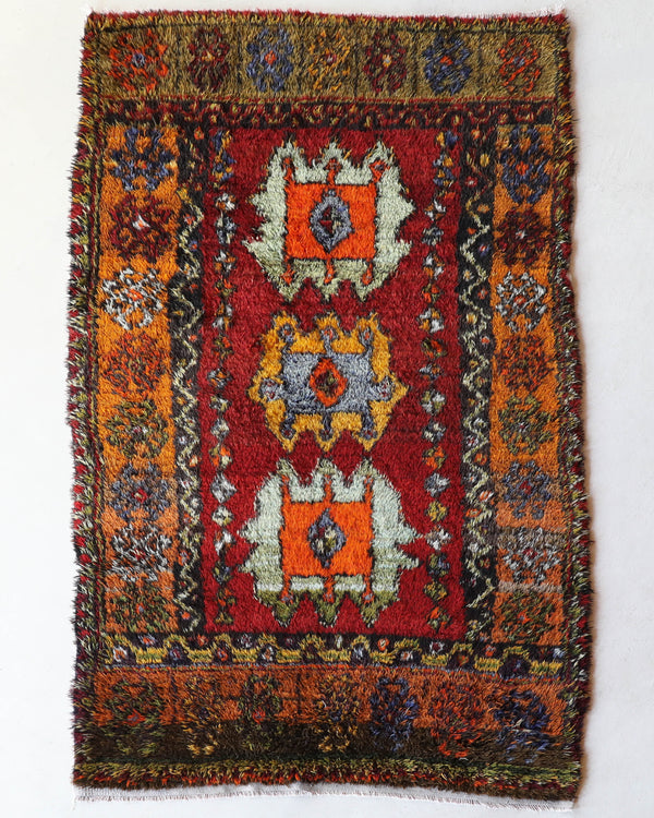 Vintage Turkish rug in a living room setting, pile rug, Turkish rug, vintage rug, portland, rug shop, bright colors, wild shaman, soft rug, bold color, Portland, Oregon, rug store, rug shop, local shop, shag rug, shaggy, plush,tulu rugs