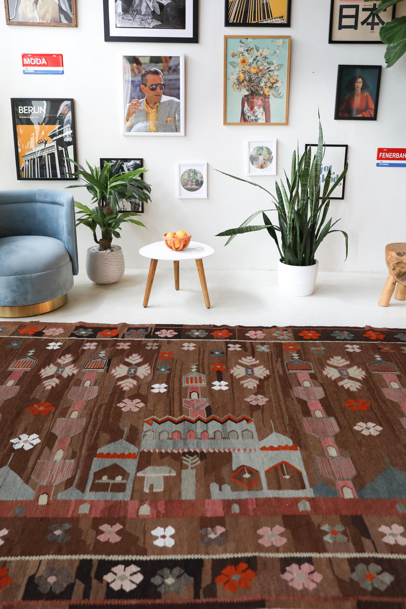 Vintage kilim rug in living room setting, old rug, antique rug, pastel colors, faded colors, Turkish rug, vintage rug, soft rug, Portland, Oregon, rug store, rug shop, local shop, earthy tones, earthy colors, warm colors