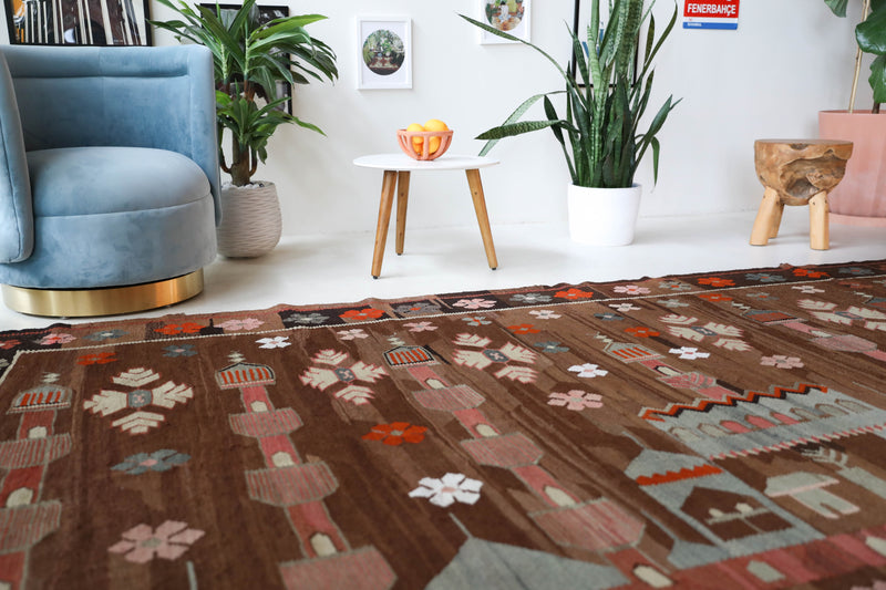 Vintage kilim rug in living room setting, old rug, antique rug, pastel colors, faded colors, Turkish rug, vintage rug, soft rug, Portland, Oregon, rug store, rug shop, local shop, earthy tones, earthy colors, warm colors