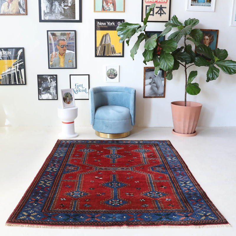 Vintage Turkish rug in a living room setting, pile rug, Turkish rug, vintage rug, portland, rug shop, bright colors, wild shaman, soft rug, bold color, Portland, Oregon, rug store, rug shop, local shop, antique rug