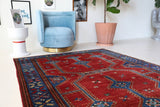 Vintage Turkish rug in a living room setting, pile rug, Turkish rug, vintage rug, portland, rug shop, bright colors, wild shaman, soft rug, bold color, Portland, Oregon, rug store, rug shop, local shop, antique rug