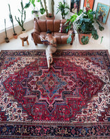 Antique Persian area rug in a living room setting, pile rug, vintage rug, portland, rug shop, bright colors, wild shaman, soft rug, bold color, Portland, Oregon, rug store, rug shop, local shop, antique rug, Persian rug, handmade rug, wool rug