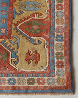 Vintage Turkish rug in a living room setting, pile rug, Turkish rug, vintage rug, portland, rug shop, bright colors, wild shaman, soft rug, bold color, Portland, Oregon, rug store, rug shop, local shop, antique rug, 