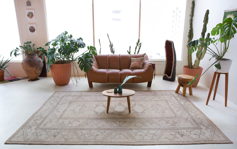 Vintage Turkish rug in living room setting, old rug, antique rug, pastel colors, faded colors, Turkish rug, vintage rug, soft rug, Portland, Oregon, rug store, rug shop, local shop