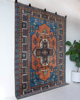 Vintage Turkish rug in living room setting, old rug, antique rug, pastel colors, faded colors, Turkish rug, vintage rug, soft rug, Portland, Oregon, rug store, rug shop, local shop, pastel colors