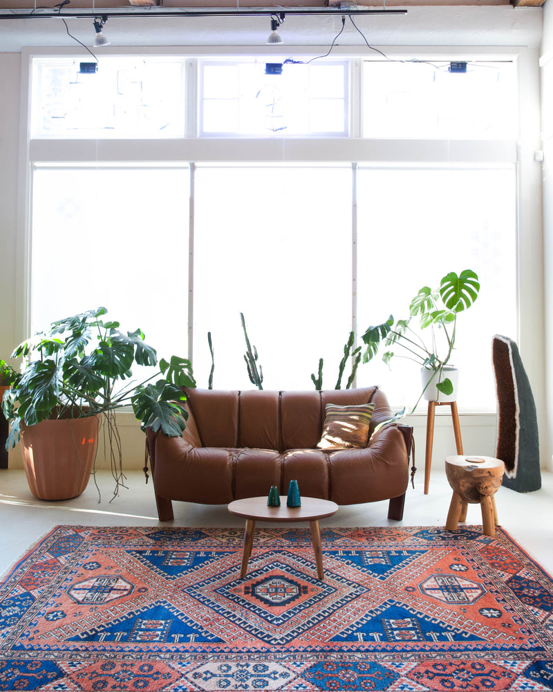 Vintage Turkish rug in living room setting, old rug, antique rug, pastel colors, faded colors, Turkish rug, vintage rug, soft rug, Portland, Oregon, rug store, rug shop, local shop, pastel colors