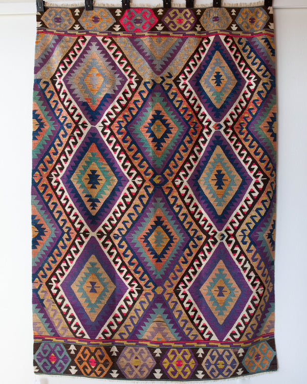 Vintage kilim rug in living room setting, bright colors, wild shaman, soft rug, bold color, Portland, Oregon, rug store, rug shop, local shop, vintage rug, modern kilim, warm colors