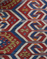 Vintage kilim rug in room decor setting, old rug, antique rug, pastel colors, faded colors, Turkish rug, vintage rug, soft rug, Portland, Oregon, rug store, rug shop, local shop, bold colors, bright colors, faded colors, antique kilim