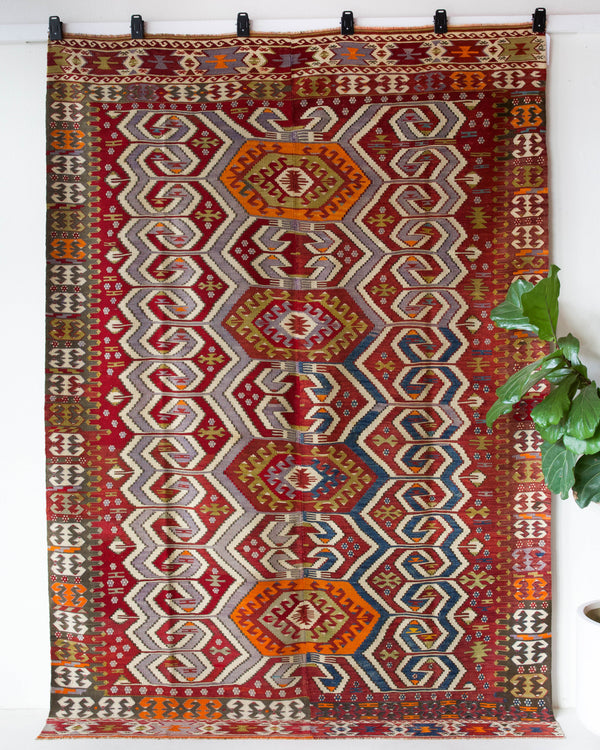 Vintage kilim rug in room decor setting, old rug, antique rug, pastel colors, faded colors, Turkish rug, vintage rug, soft rug, Portland, Oregon, rug store, rug shop, local shop, bold colors, bright colors, faded colors, antique kilim