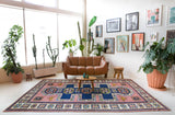 Vintage Turkish rug in a living room setting, pile rug, Turkish rug, vintage rug, portland, rug shop, bright colors, wild shaman, soft rug, bold color, Portland, Oregon, rug store, rug shop, local shop