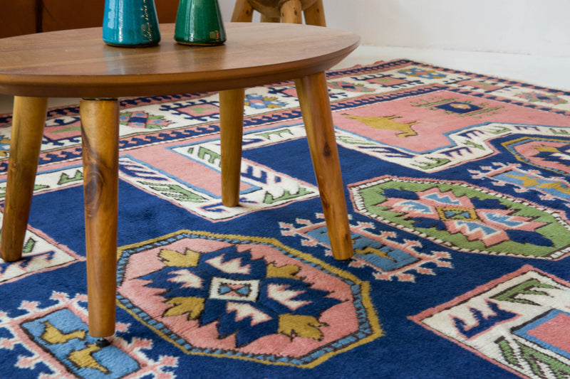 Vintage Turkish rug in a living room setting, pile rug, Turkish rug, vintage rug, portland, rug shop, bright colors, wild shaman, soft rug, bold color, Portland, Oregon, rug store, rug shop, local shop