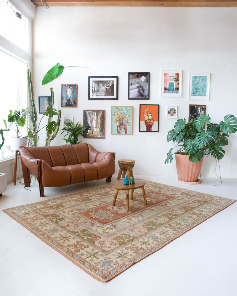 Vintage Turkish rug in living room setting, old rug, antique rug, pastel colors, faded colors, Turkish rug, vintage rug, soft rug, Portland, Oregon, rug store, rug shop, local shop