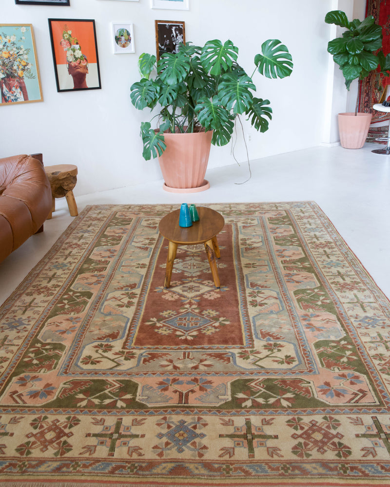 Vintage Turkish rug in living room setting, old rug, antique rug, pastel colors, faded colors, Turkish rug, vintage rug, soft rug, Portland, Oregon, rug store, rug shop, local shop