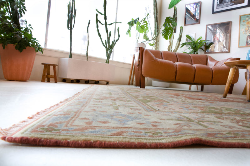 Vintage Turkish rug in living room setting, old rug, antique rug, pastel colors, faded colors, Turkish rug, vintage rug, soft rug, Portland, Oregon, rug store, rug shop, local shop