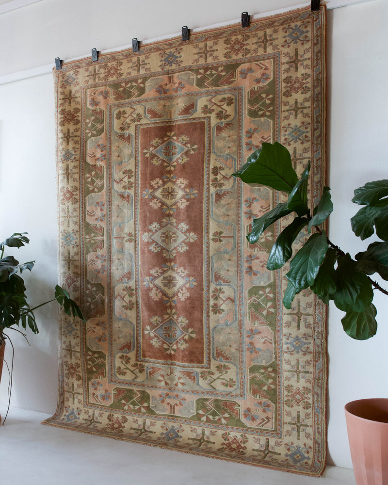 Vintage Turkish rug in living room setting, old rug, antique rug, pastel colors, faded colors, Turkish rug, vintage rug, soft rug, Portland, Oregon, rug store, rug shop, local shop