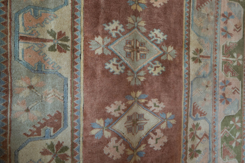 Vintage Turkish rug in living room setting, old rug, antique rug, pastel colors, faded colors, Turkish rug, vintage rug, soft rug, Portland, Oregon, rug store, rug shop, local shop