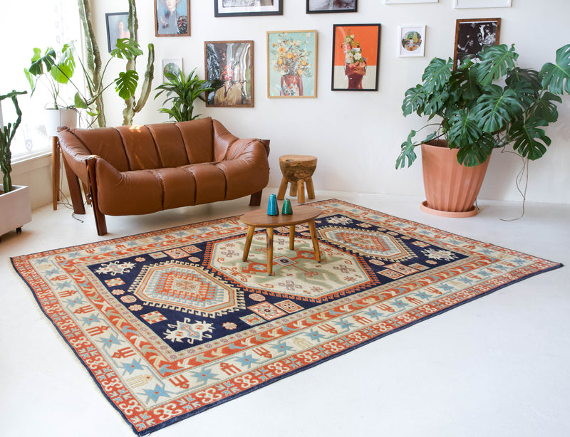 Vintage Turkish rug in a living room setting, pile rug, Turkish rug, vintage rug, portland, rug shop, bright colors, wild shaman, soft rug, bold color, Portland, Oregon, rug store, rug shop, local shop