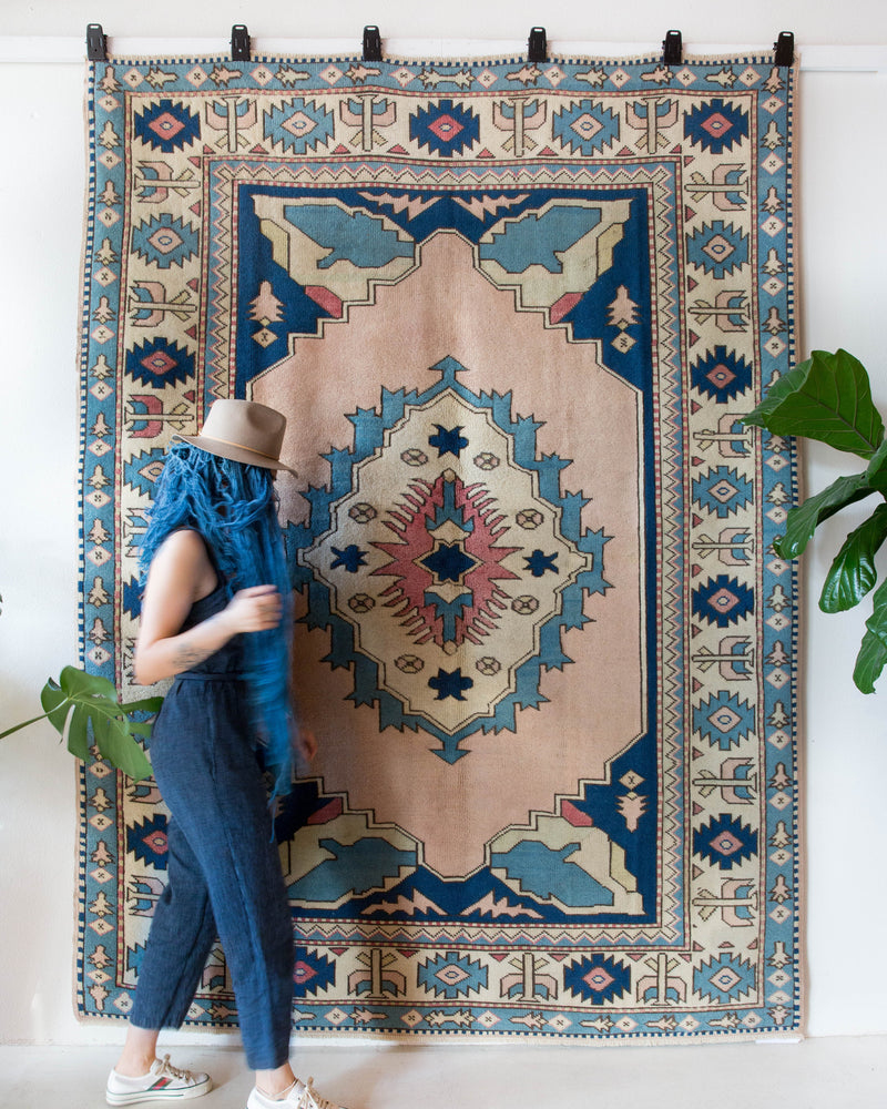 Vintage Turkish rug in living room setting, old rug, antique rug, pastel colors, faded colors, Turkish rug, vintage rug, soft rug, Portland, Oregon, rug store, rug shop, local shop