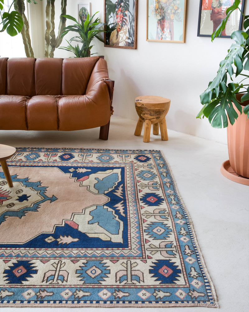 Vintage Turkish rug in living room setting, old rug, antique rug, pastel colors, faded colors, Turkish rug, vintage rug, soft rug, Portland, Oregon, rug store, rug shop, local shop