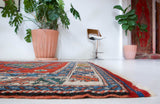 Vintage Turkish rug in a living room setting, pile rug, Turkish rug, vintage rug, portland, rug shop, bright colors, wild shaman, soft rug, bold color, Portland, Oregon, rug store, rug shop, local shop, antique rug