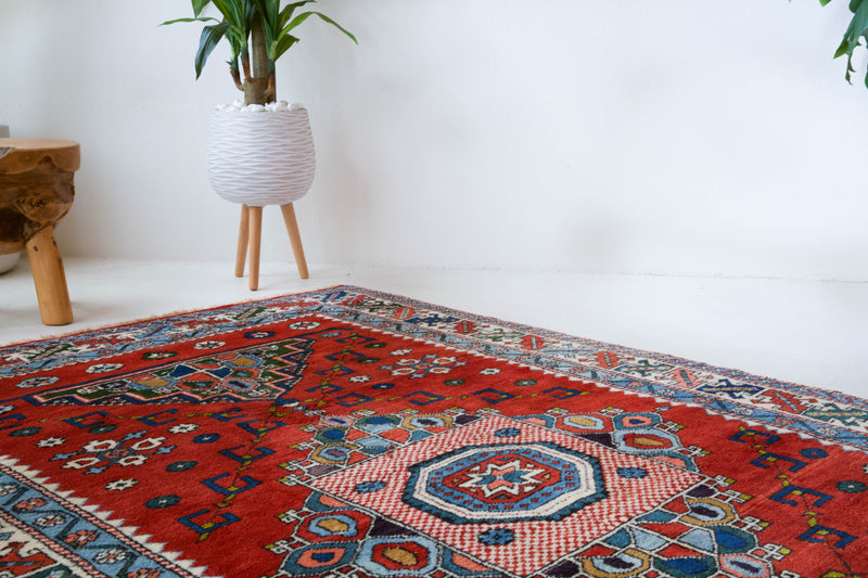 Vintage Turkish rug in a living room setting, pile rug, Turkish rug, vintage rug, portland, rug shop, bright colors, wild shaman, soft rug, bold color, Portland, Oregon, rug store, rug shop, local shop, antique rug