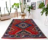 Vintage Turkish rug in a living room setting, pile rug, Turkish rug, vintage rug, portland, rug shop, bright colors, wild shaman, soft rug, bold color, Portland, Oregon, rug store, rug shop, local shop, antique rug