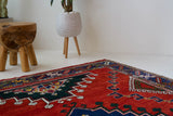 Vintage Turkish rug in a living room setting, pile rug, Turkish rug, vintage rug, portland, rug shop, bright colors, wild shaman, soft rug, bold color, Portland, Oregon, rug store, rug shop, local shop, antique rug