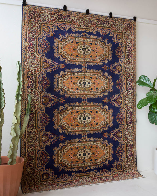 Vintage Turkish rug in a living room setting, pile rug, Turkish rug, vintage rug, portland, rug shop, bright colors, wild shaman, soft rug, bold color, Portland, Oregon, rug store, rug shop, local shop, antique rug