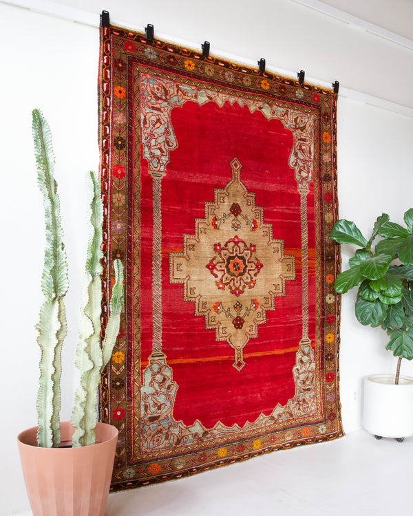 Vintage Turkish rug in a living room setting, pile rug, Turkish rug, vintage rug, portland, rug shop, bright colors, wild shaman, soft rug, bold color, Portland, Oregon, rug store, rug shop, local shop, antique rug