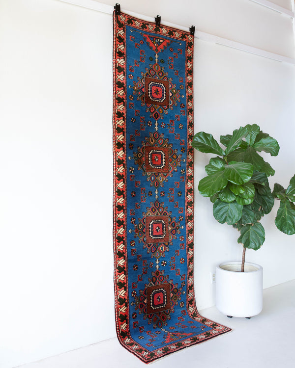 Vintage Turkish runner rug in a living room setting, pile rug, Turkish rug, vintage rug, portland, rug shop, bright colors, wild shaman, soft rug, bold color, Portland, Oregon, rug store, rug shop, local shop, antique rug