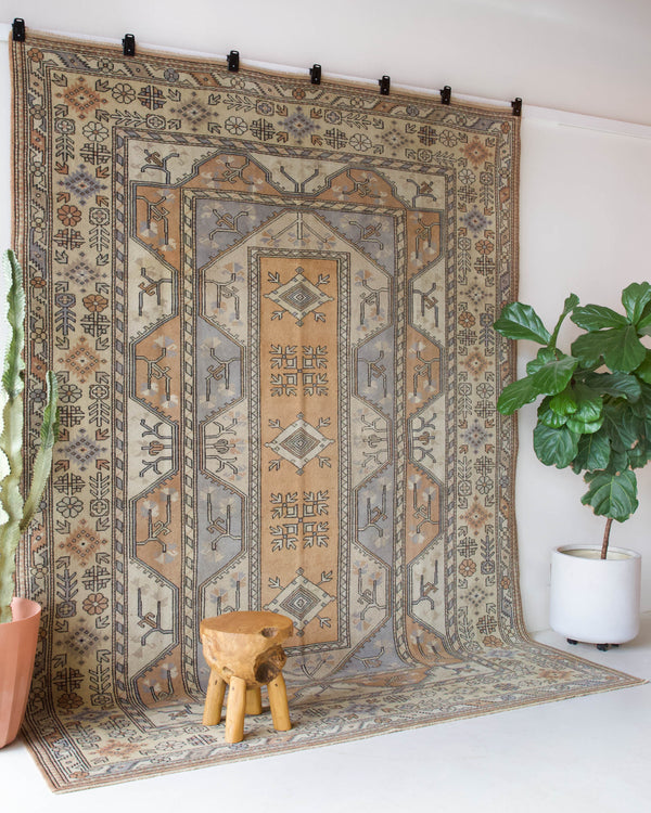 Vintage Turkish rug in living room setting, old rug, antique rug, pastel colors, faded colors, Turkish rug, vintage rug, soft rug, Portland, Oregon, rug store, rug shop, local shop