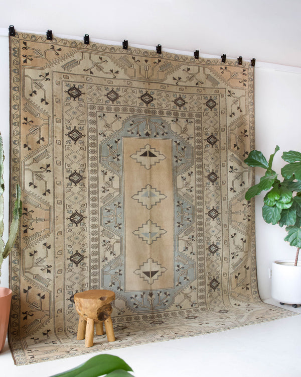 Vintage Turkish rug in living room setting, old rug, antique rug, pastel colors, faded colors, Turkish rug, vintage rug, soft rug, Portland, Oregon, rug store, rug shop, local shop