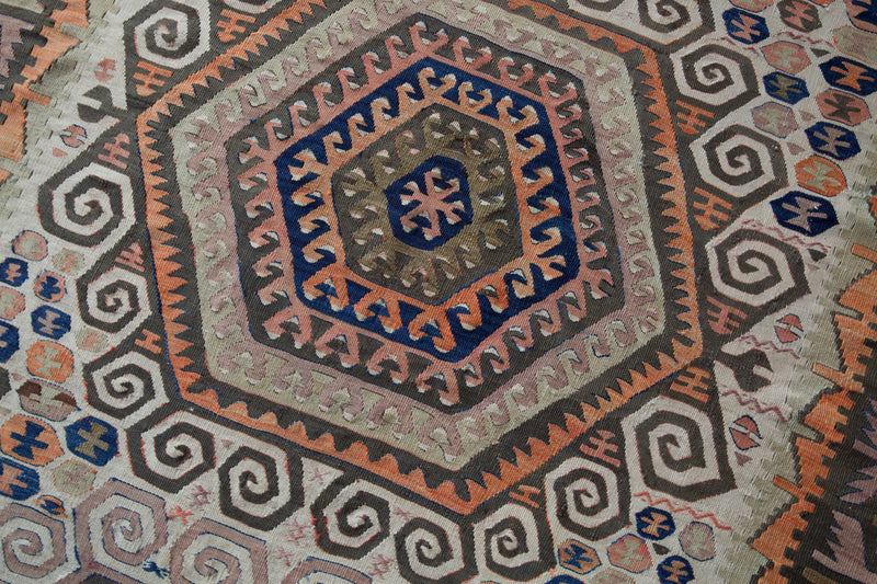 Vintage kilim rug in room decor setting, old rug, antique rug, pastel colors, faded colors, Turkish rug, vintage rug, soft rug, Portland, Oregon, rug store, rug shop, local shop, bold colors, bright colors, faded colors