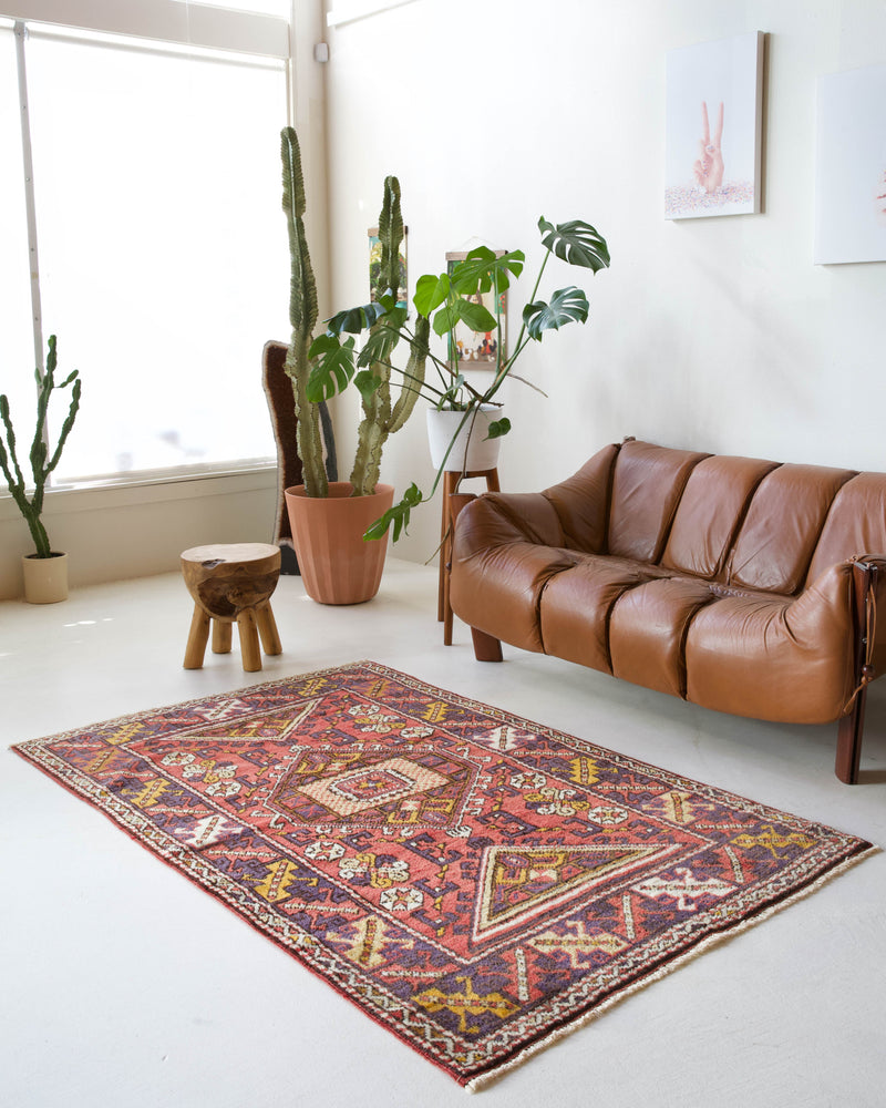 Vintage Turkish rug in living room setting, old rug, antique rug, pastel colors, faded colors, Turkish rug, vintage rug, soft rug, Portland, Oregon, rug store, rug shop, local shop