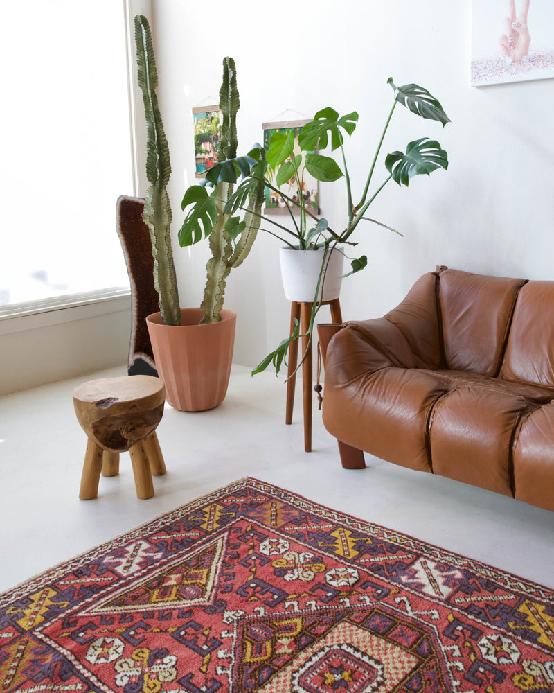 Vintage Turkish rug in living room setting, old rug, antique rug, pastel colors, faded colors, Turkish rug, vintage rug, soft rug, Portland, Oregon, rug store, rug shop, local shop