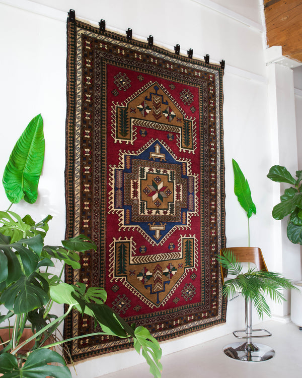 Vintage caucasian rug in a living room setting, pile rug, Turkish rug, vintage rug, portland, rug shop, bright colors, wild shaman, soft rug, bold color, Portland, Oregon, rug store, rug shop, local shop, soft rug, pastel colors, faded colors