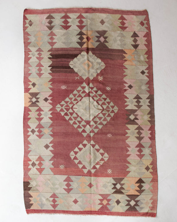 Vintage kilim rug in room decor setting, old rug, antique rug, pastel colors, faded colors, Turkish rug, vintage rug, soft rug, Portland, Oregon, rug store, rug shop, local shop, bold colors, bright colors, faded colors